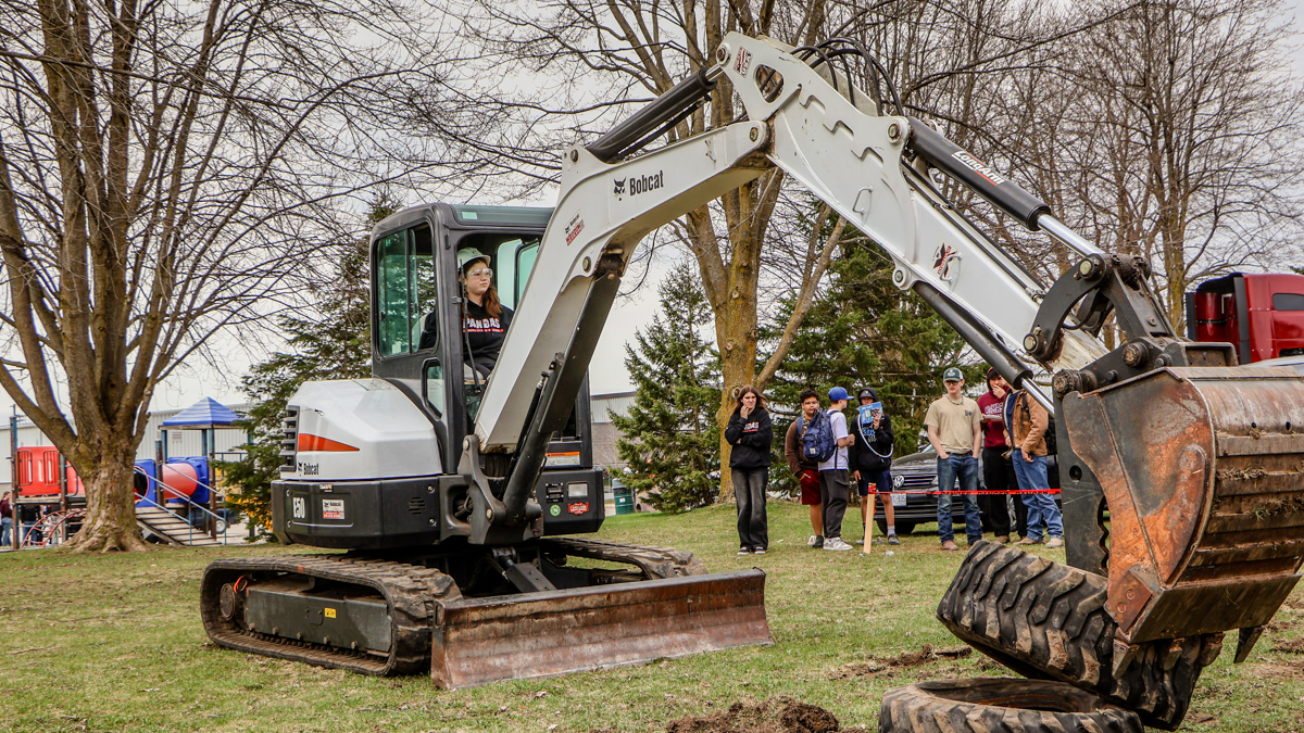 Student exploring heavy equipment